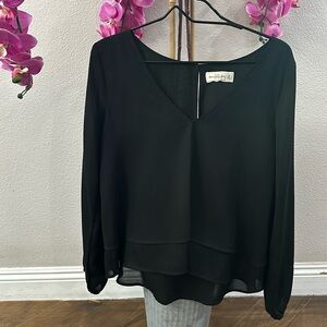 Abercrombie women’s black sheer blouse.